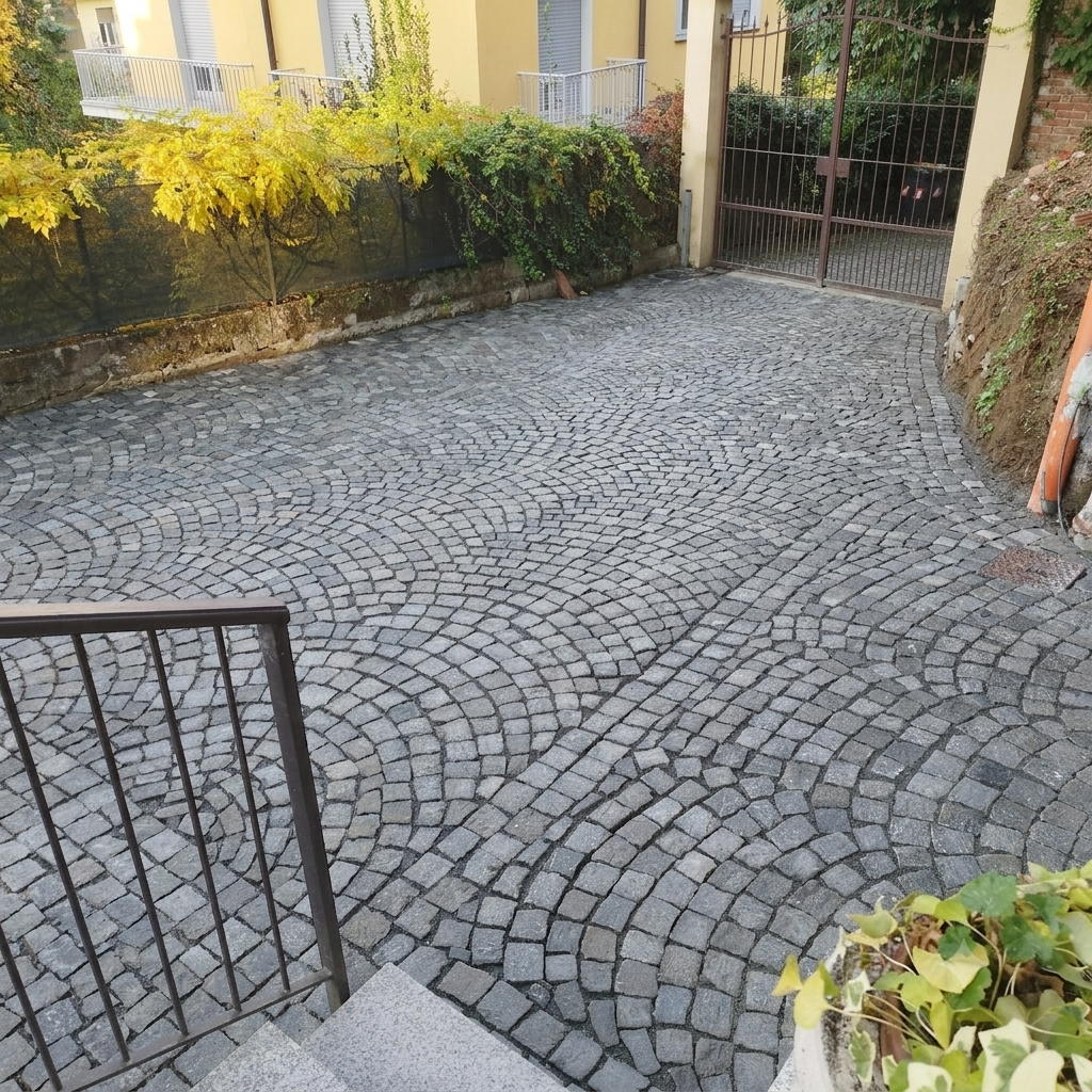 Posa porfido a coda di pavone per cortili e rampe carrabili a Torino